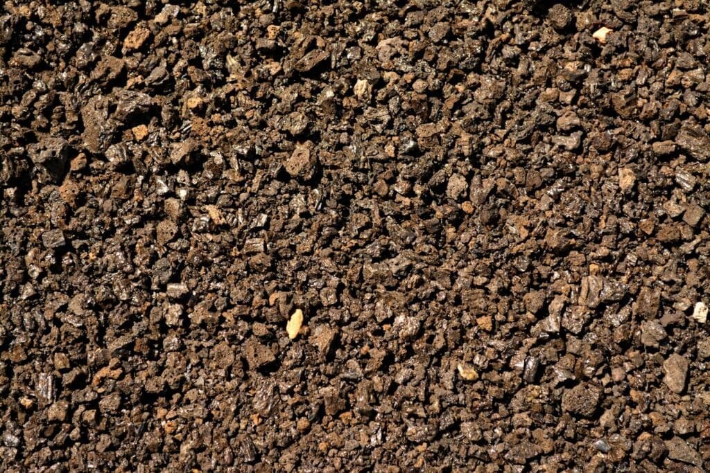 a close up of a dirt surface with small rocks